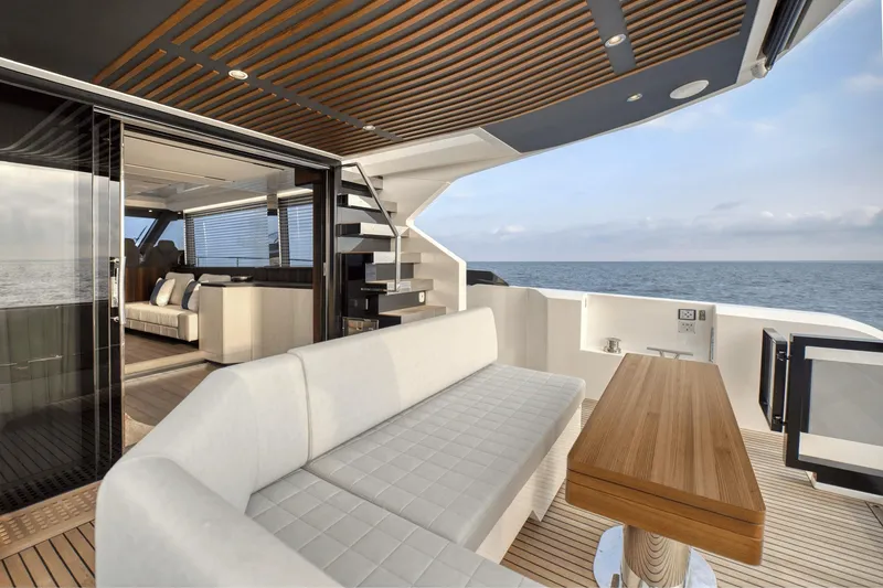 Slide: The Image of Luxurious 2026 Astondoa AS5 yacht interior with elegant seating and ocean view. - 11