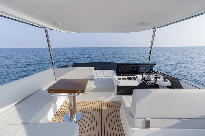 Slide: The Image of Luxurious 2026 Astondoa AS5 yacht interior with modern helm and ocean view. - 15