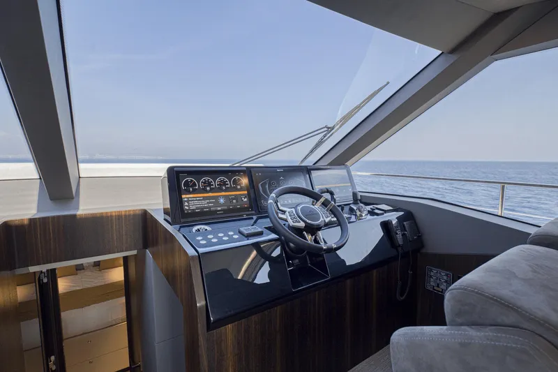 Slide: The Image of Helm of 2026 Astondoa AS5 yacht with modern controls and ocean view. - 18