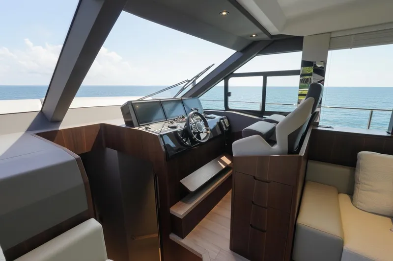 Slide: The Image of 2026 Astondoa AS5 yacht helm with modern controls and ocean view. - 19