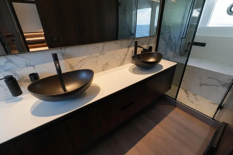 Slide: The Image of Luxurious bathroom in 2026 Astondoa AS5 yacht with modern vessel sinks and marble accents. - 21