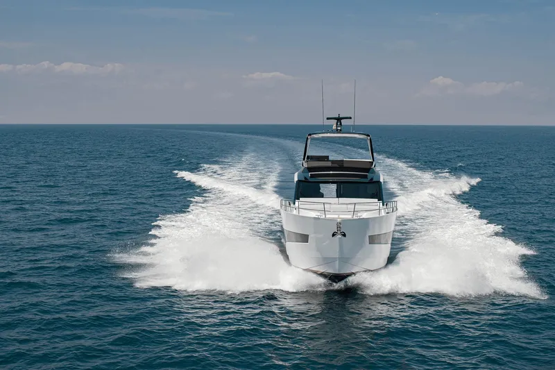 Slide: The Image of Astondoa AS5 2026 yacht cruising on open sea under clear sky. - 7