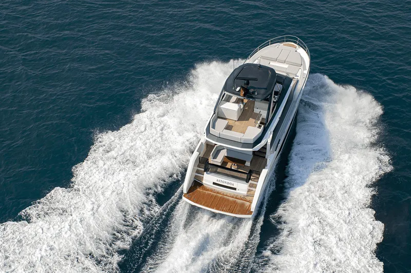 Slide: The Image of 2026 Astondoa AS5 yacht cruising on open water, aerial view. - 8