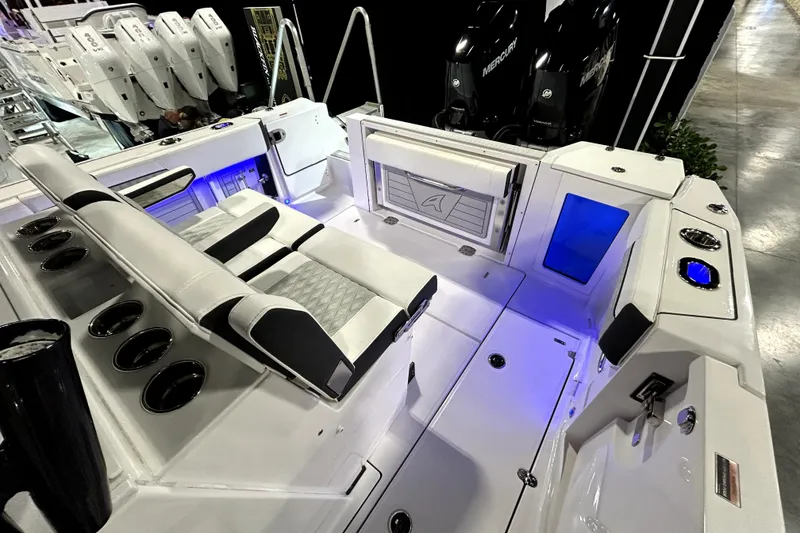 Slide: The Image of 2026 Blackfin 332 CC boat interior with seating and illuminated features. - 13