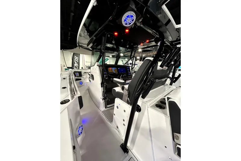Slide: The Image of 2026 Blackfin 332 CC boat interior with modern controls and seating. - 9