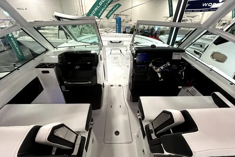 Slide: The Image of 2026 Blackfin 302 DC boat interior with modern helm and seating at a boat show. - 10