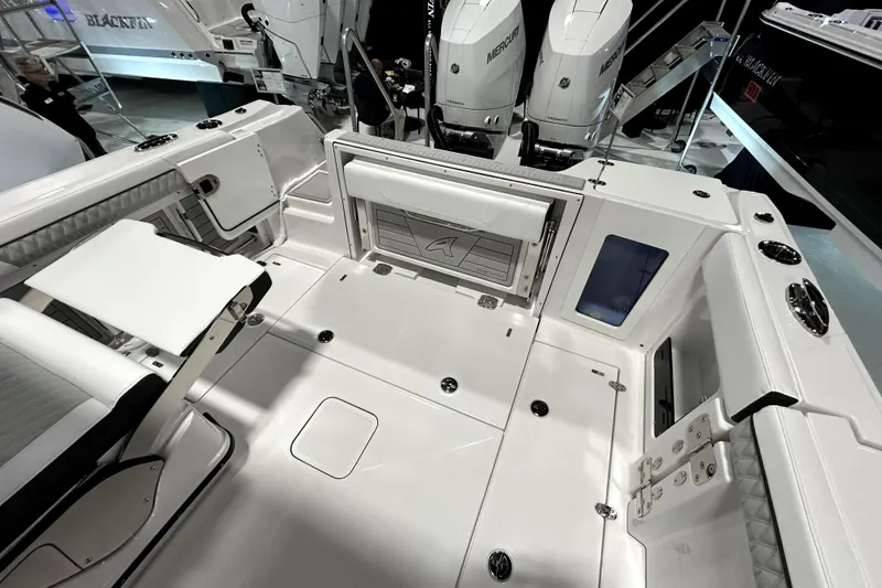 Slide: The Image of 2026 Blackfin 302 DC boat interior with seating and storage compartments. - 11