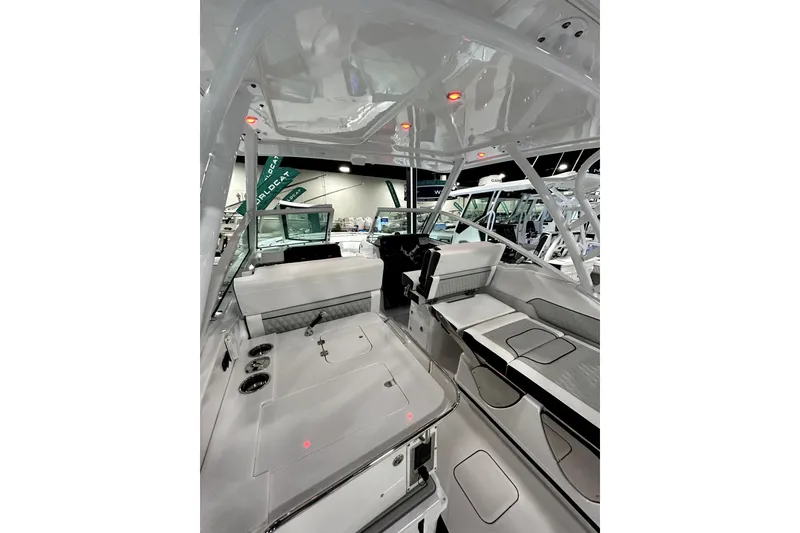 Slide: The Image of Interior view of 2026 Blackfin 302 DC boat, showcasing sleek seating and modern design. - 14