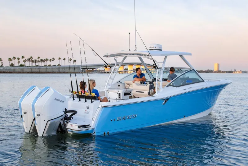 Slide: The Image of Manufacturer Provided Image: 2026 Blackfin 302 DC boat on water, featuring dual engines and fishing rods. - 6