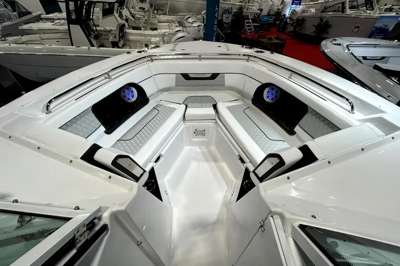 Slide: The Image of 2026 Blackfin 302 DC boat interior with sleek seating and modern speakers. - 8