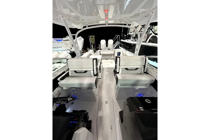 Slide: The Image of 2026 Blackfin 302 DC boat interior with modern seating and sleek design. - 9