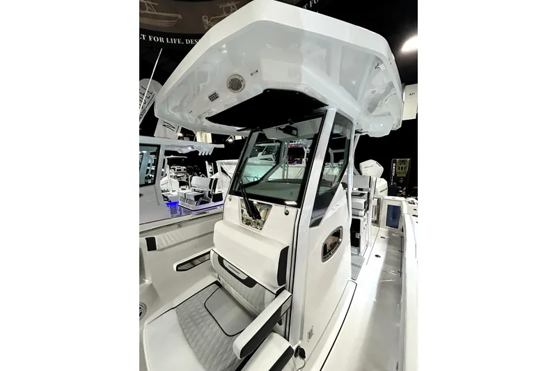 Slide: The Image of 2026 Blackfin 272 CC boat interior with modern helm and seating. - 11