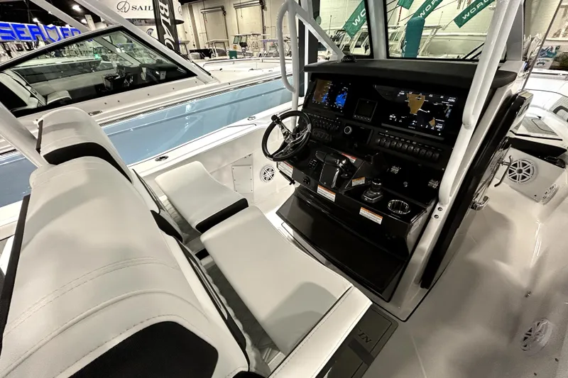 Slide: The Image of 2026 Blackfin 272 CC boat interior with modern dashboard and seating. - 13