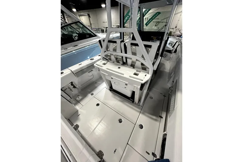 Slide: The Image of 2026 Blackfin 272 CC boat interior showcasing spacious deck and seating area. - 17