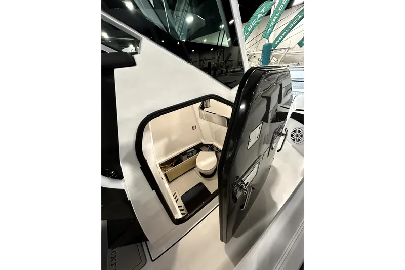 Slide: The Image of 2026 Blackfin 272 CC boat interior with open cabin door, showcasing modern design. - 18