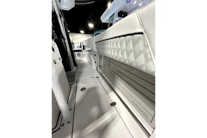 Slide: The Image of 2026 Blackfin 272 CC boat interior with quilted seating and sleek design. - 21