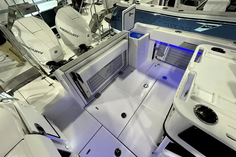 Slide: The Image of 2026 Blackfin 252 CC boat interior with Mercury engines, featuring spacious deck and modern amenities. - 11
