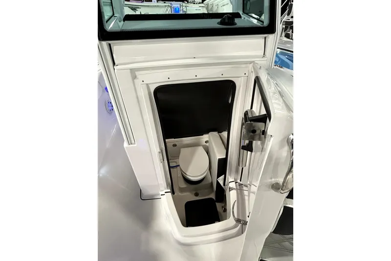 Slide: The Image of 2026 Blackfin 252 CC boat interior with compact marine toilet. - 13