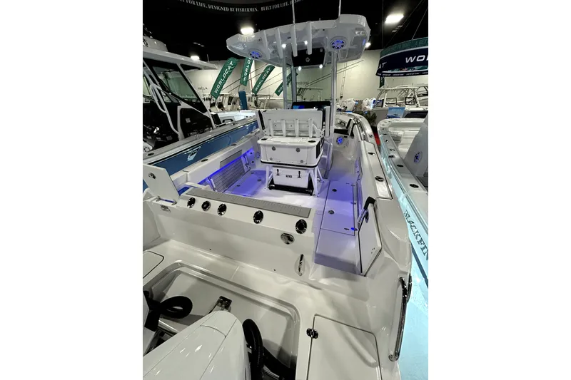 Slide: The Image of 2026 Blackfin 252 CC boat interior with modern features and blue LED lighting. - 15