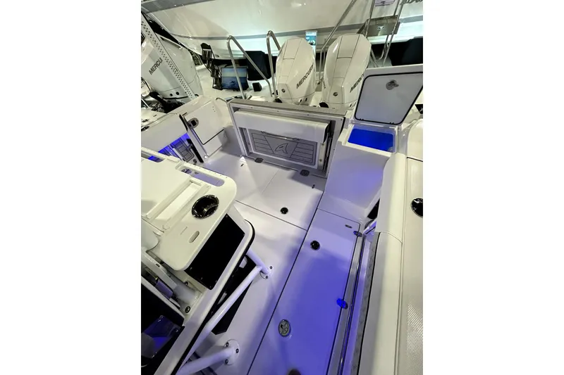 Slide: The Image of 2026 Blackfin 252 CC boat interior with dual Mercury engines, featuring modern design and storage compartments. - 5