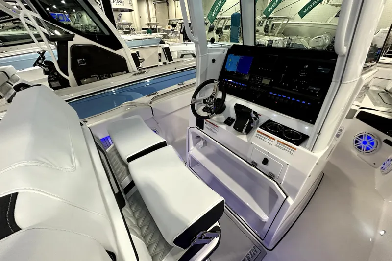 Slide: The Image of 2026 Blackfin 252 CC boat interior with modern dashboard and seating. - 6