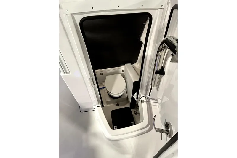Slide: The Image of 2026 Blackfin 252 CC boat interior with compact marine toilet. - 7