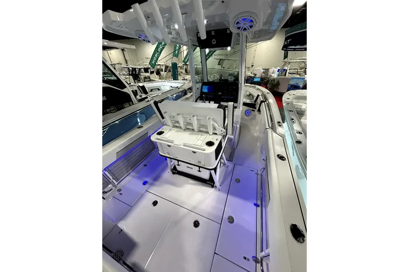 Slide: The Image of 2026 Blackfin 252 CC boat interior with modern design and blue LED lighting. - 8