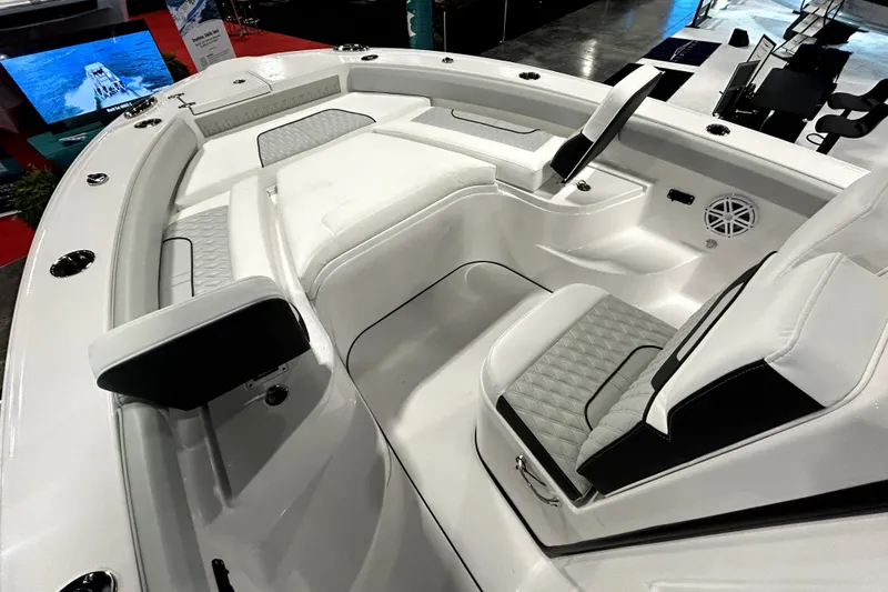 Slide: The Image of 2026 Blackfin 242 HB boat interior with sleek white seating and modern design. - 12