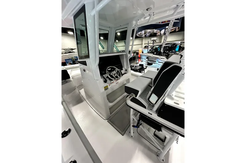 Slide: The Image of 2026 Blackfin 242 HB boat interior with modern helm and seating. - 14