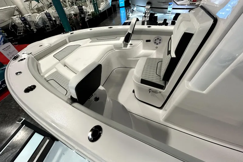 Slide: The Image of 2026 Blackfin 242 HB boat interior with cushioned seating and modern design. - 15