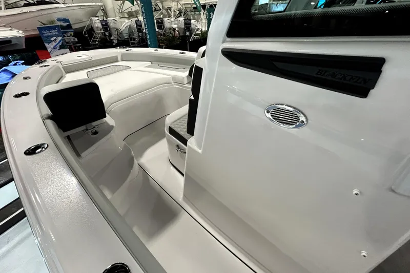 Slide: The Image of 2026 Blackfin 242 HB boat interior with sleek seating and modern design. - 9