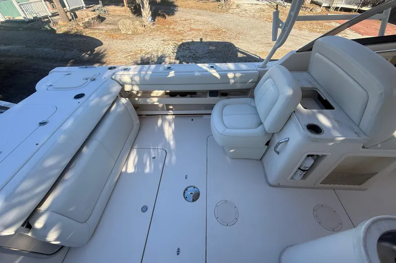 Slide: The Image of 2015 Grady-White Freedom 307 boat interior with white seating and deck. - 12