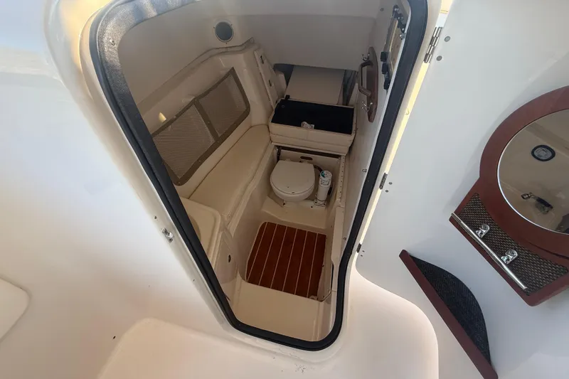Slide: The Image of 2015 Grady-White Freedom 307 boat interior with toilet and storage area. - 14