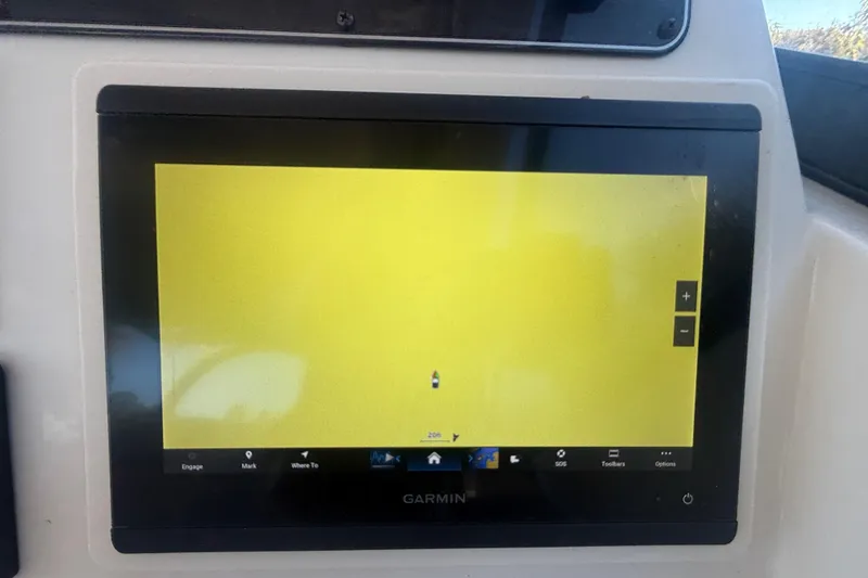 Slide: The Image of Garmin navigation display on 2015 Grady-White Freedom 307 boat, showing a yellow screen. - 20