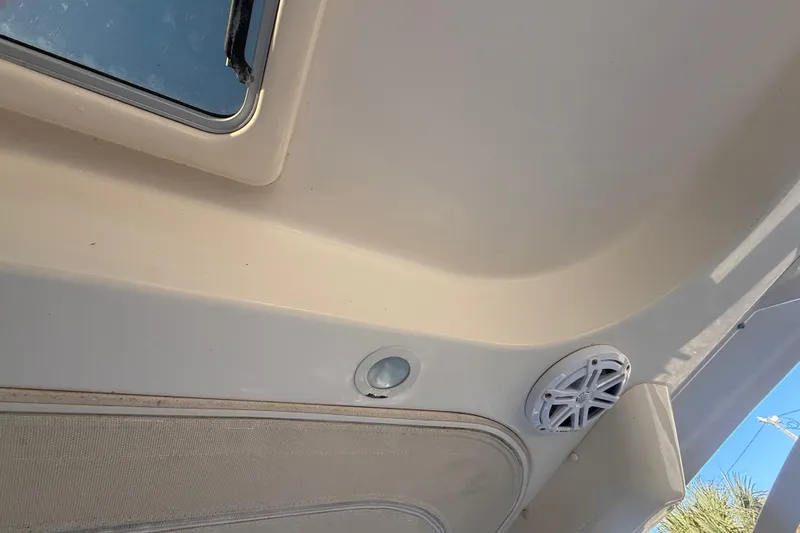 Slide: The Image of Interior view of 2015 Grady-White Freedom 307 boat ceiling with speaker and window. - 22