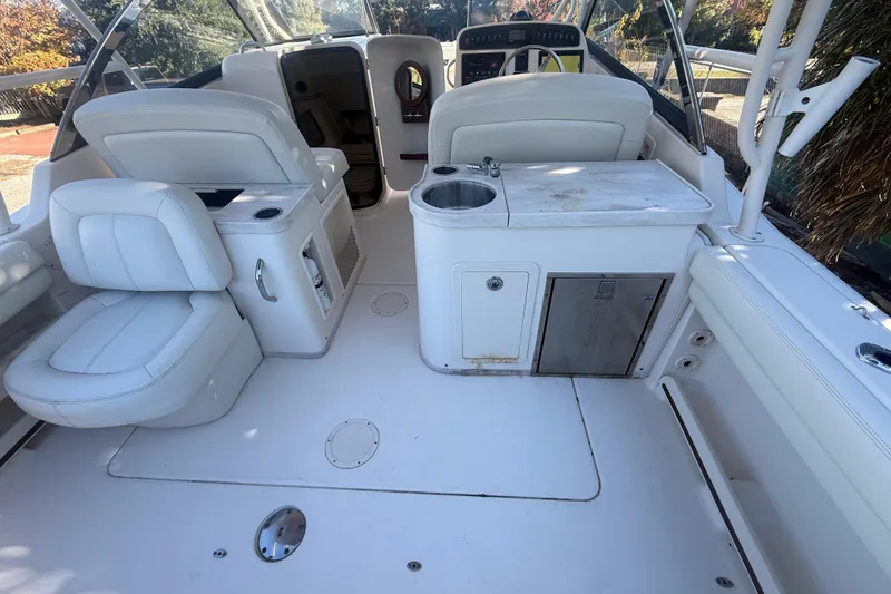 Slide: The Image of 2015 Grady-White Freedom 307 boat interior with seating and kitchenette area. - 23