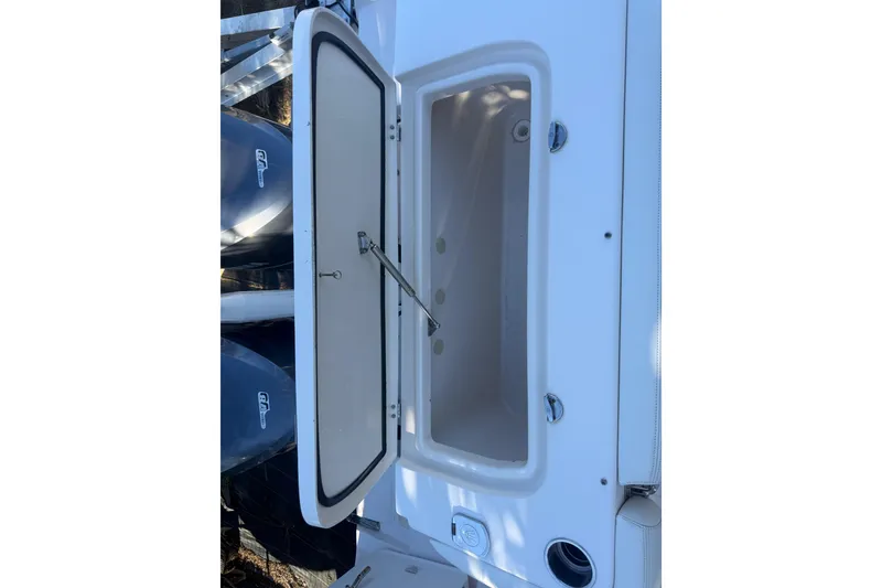 Slide: The Image of Open storage compartment on 2015 Grady-White Freedom 307 boat. - 29