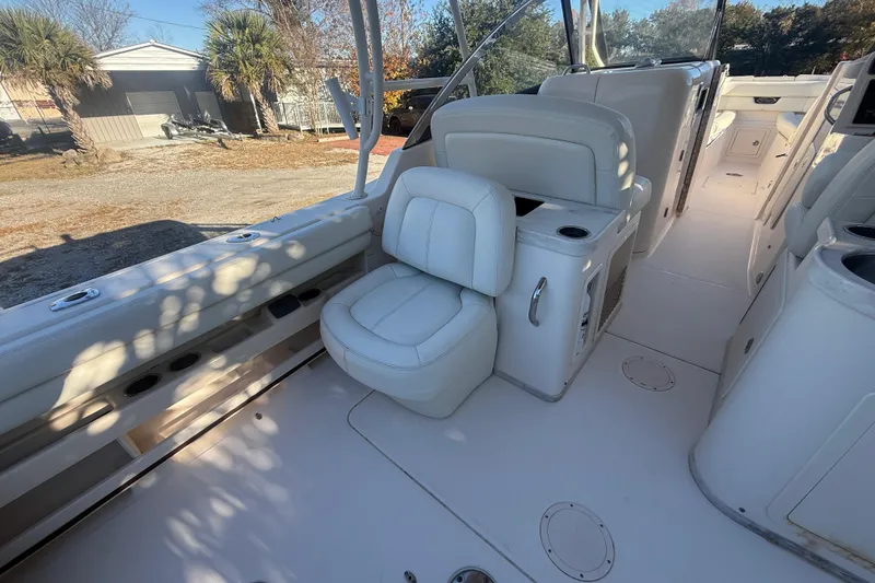 Slide: The Image of 2015 Grady-White Freedom 307 boat interior with white seating and spacious layout. - 34