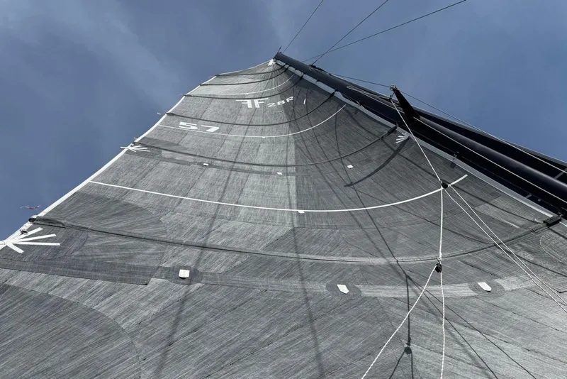 Slide: The Image of Sail of 1998 Corsair F-28R #57 against clear blue sky. - 12