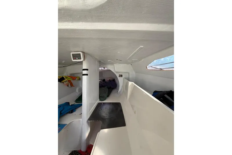 Slide: The Image of Interior of 1998 Corsair F-28R #57 sailboat, featuring compact cabin space. - 14