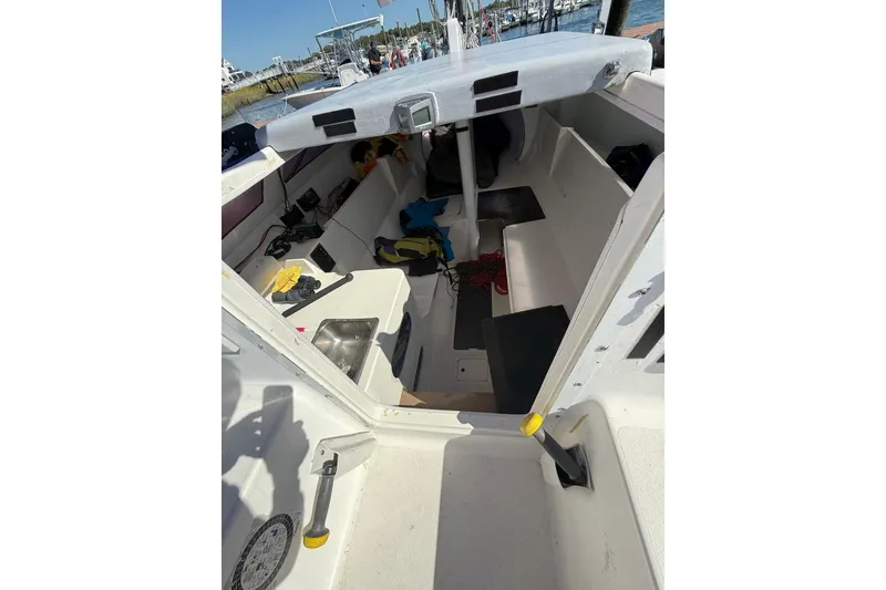 Slide: The Image of Interior of a 1998 Corsair F-28R #57 sailboat, showing seating and equipment. - 19