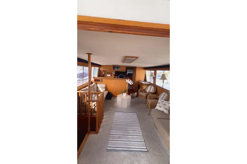The Image of Interior of 1985 Kong & Halvorsen Island Gypsy yacht, featuring cozy seating and elegant decor. - 1