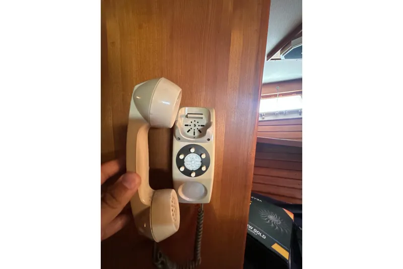 Slide: The Image of Vintage rotary phone on 1985 Kong & Halvorsen Island Gypsy yacht interior. - 12