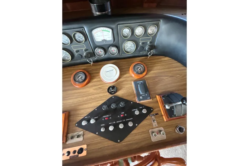 Slide: The Image of Control panel of a 1985 Kong & Halvorsen Island Gypsy boat with gauges and switches. - 15