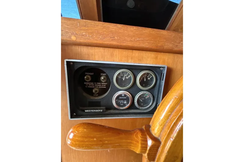 Slide: The Image of 1985 Kong & Halvorsen Island Gypsy dashboard with gauges and wooden steering wheel. - 16