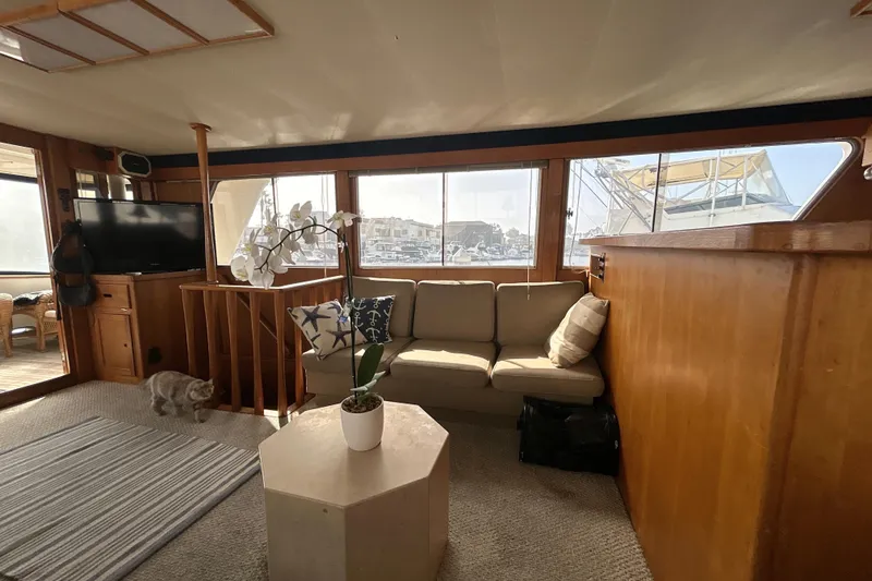 Slide: The Image of Interior of 1985 Kong & Halvorsen Island Gypsy yacht with cozy seating and decor. - 21