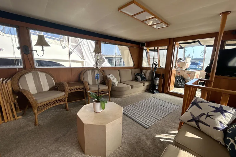 Slide: The Image of 1985 Kong & Halvorsen Island Gypsy yacht interior with cozy seating and nautical decor. - 22