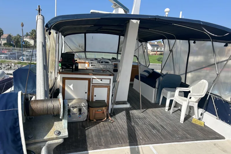 Slide: The Image of 1985 Kong & Halvorsen Island Gypsy boat interior with seating and navigation equipment. - 36