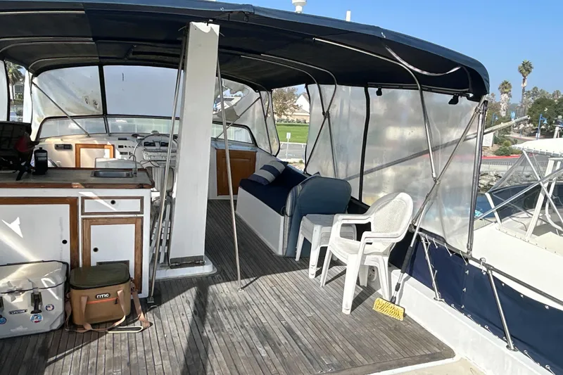 Slide: The Image of 1985 Kong & Halvorsen Island Gypsy boat interior with seating and helm station. - 37