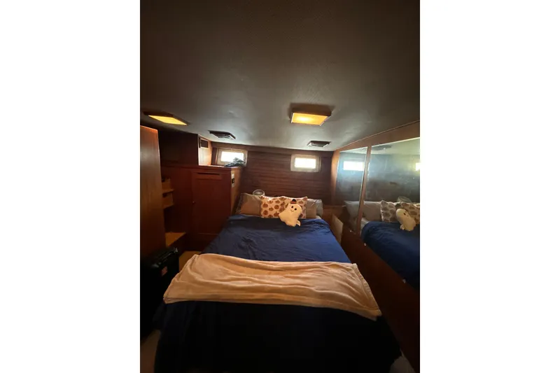 Slide: The Image of Cozy bedroom interior of 1985 Kong & Halvorsen Island Gypsy yacht with plush bedding. - 5